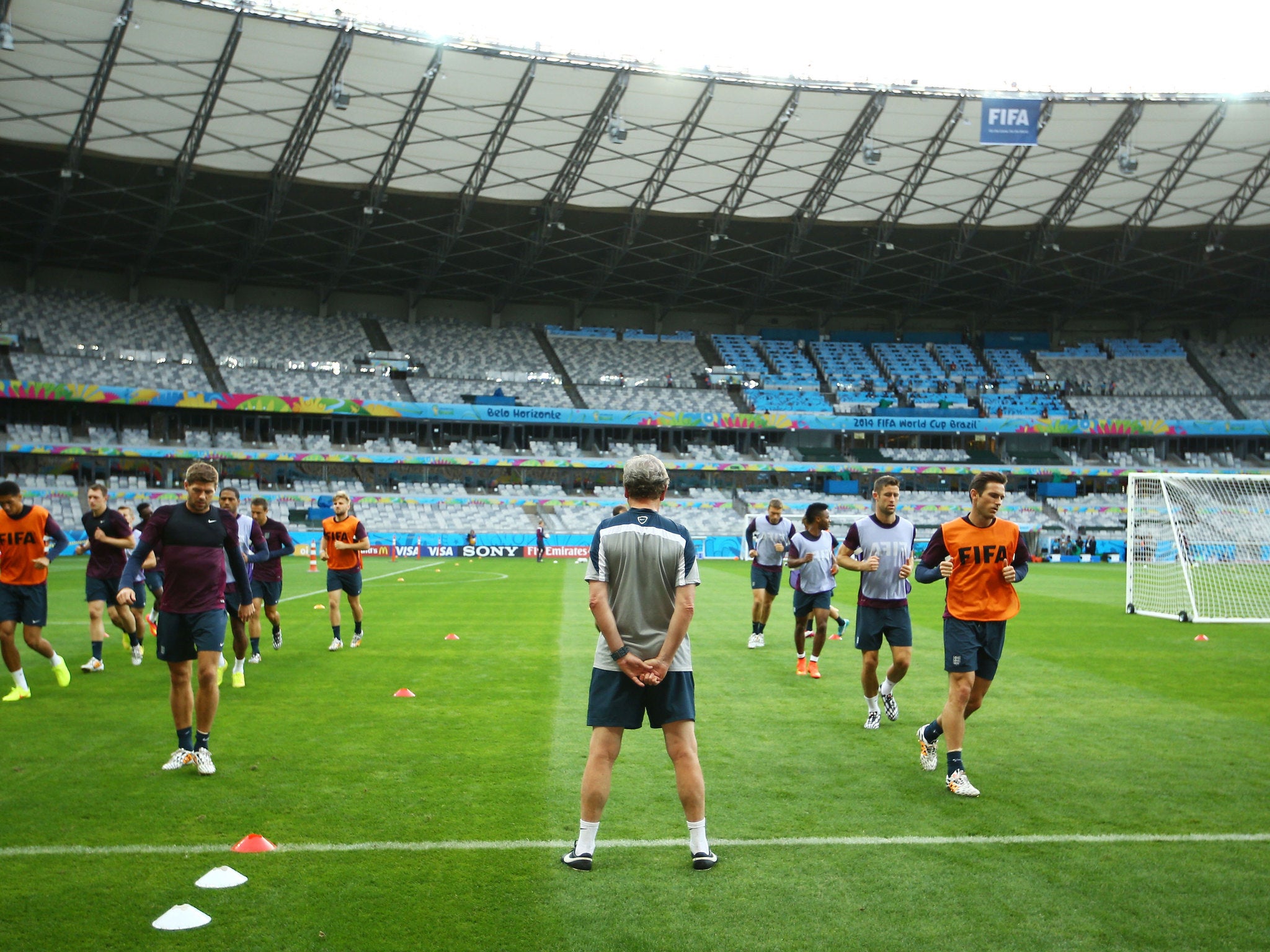 England manager Roy Hodgson looks on as his players run drills during an England training session ahead of the 2014 FIFA World Cup Brazil Group D match against Costa Rica at Estadio Mineirao in Belo Horizonte, Brazil.