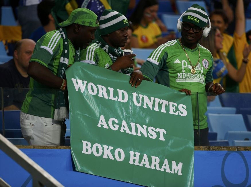 Nigerian fans hold a banner against Boko Haram during their 2014 World Cup Group F soccer match agaisnt Bosnia at the Pantanal arena in Cuiaba June 21, 2014.