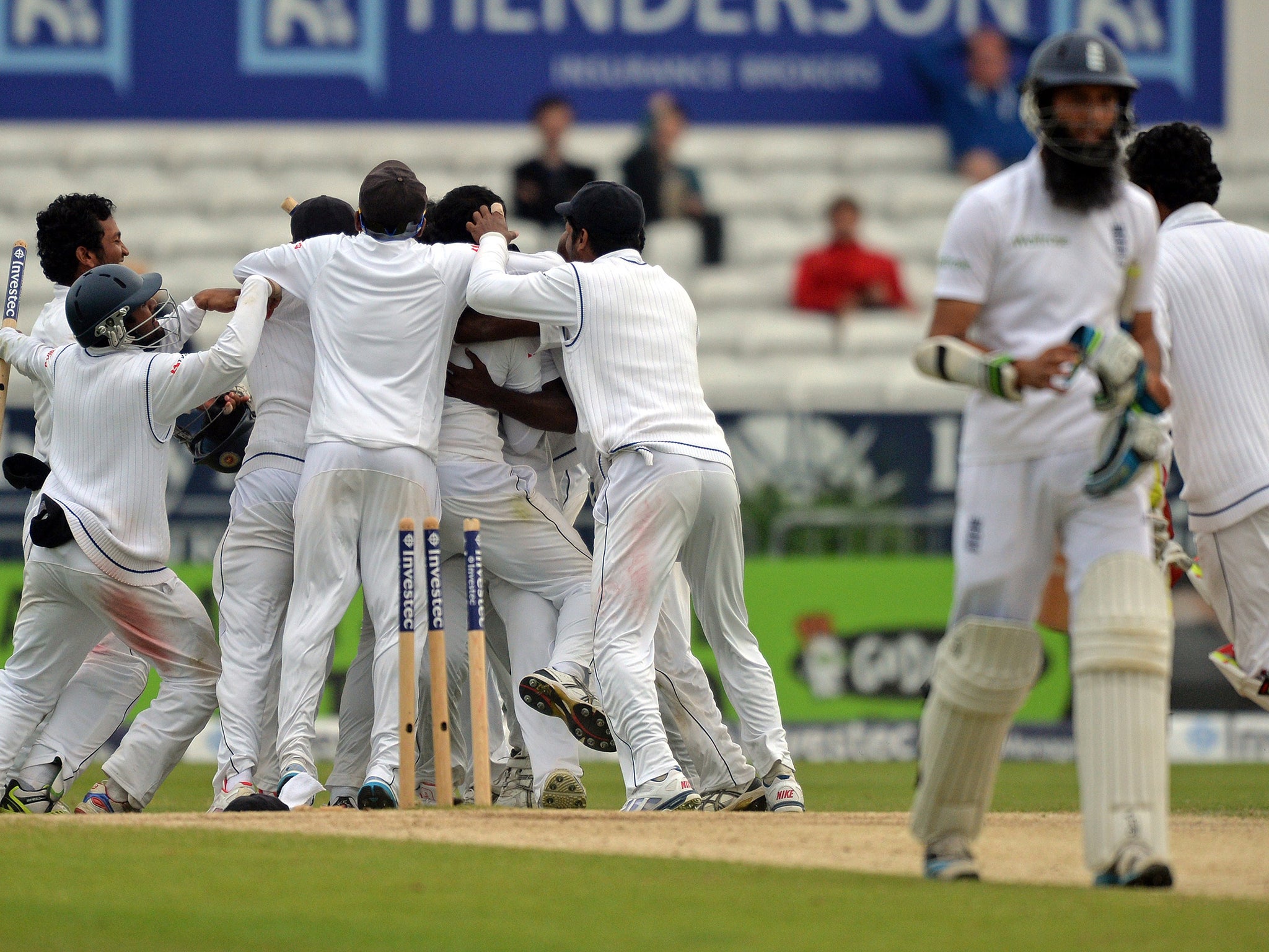 Sri Lankan players celebrate after taking the wicket of England's James Anderson with the penultimate ball of the game
