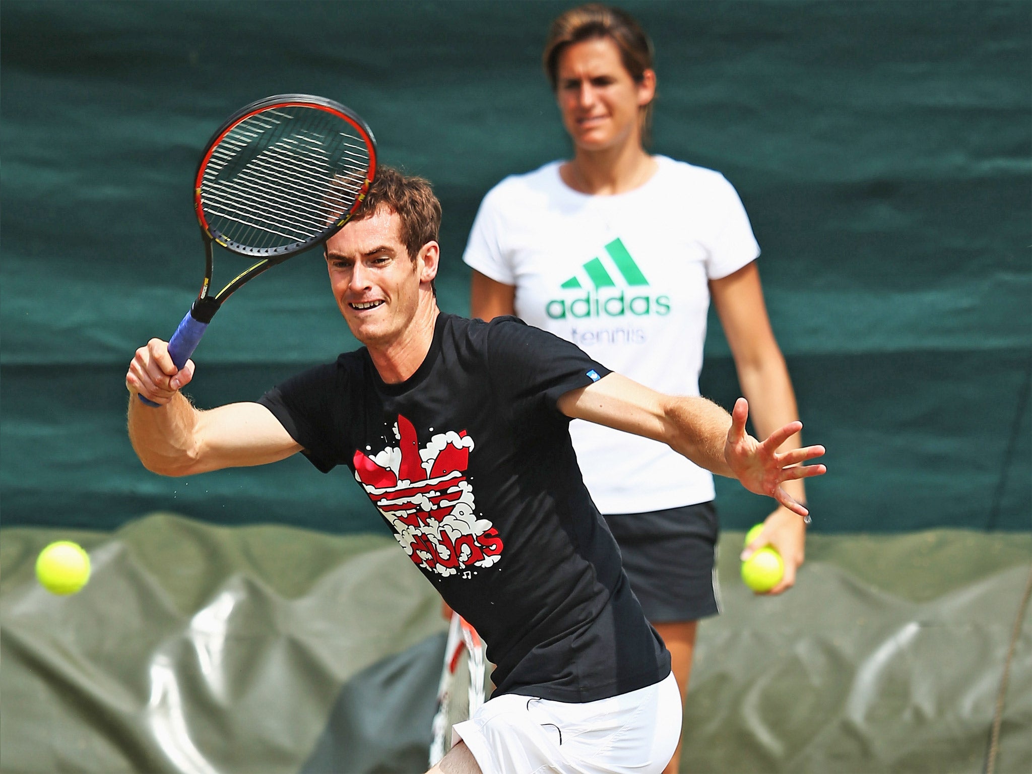 Amélie Mauresmo watches Andy Murray practise at Wimbledon