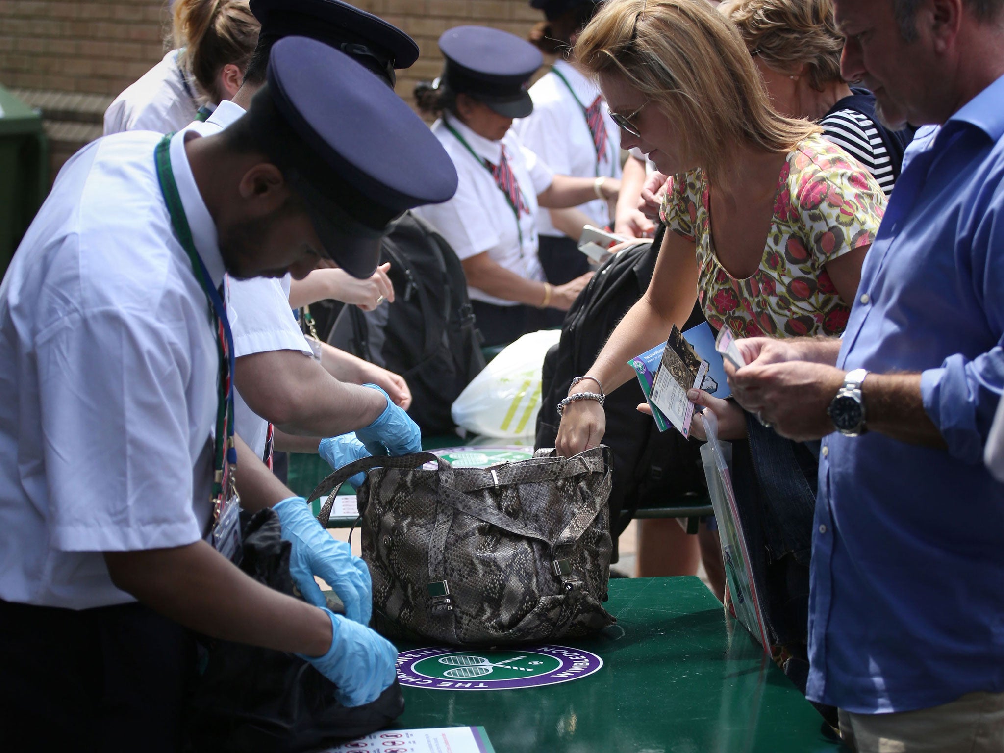 Bags being searched during day two of the Wimbledon Championships at the All England Lawn Tennis and Croquet Club, Wimbledon