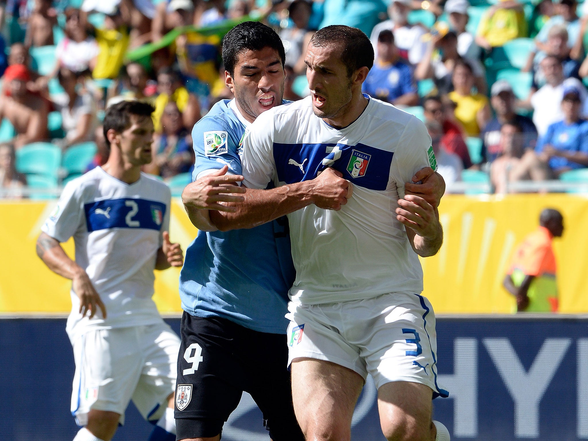 Suarez can be seen trying to bite Chiellini's shoulder during the match