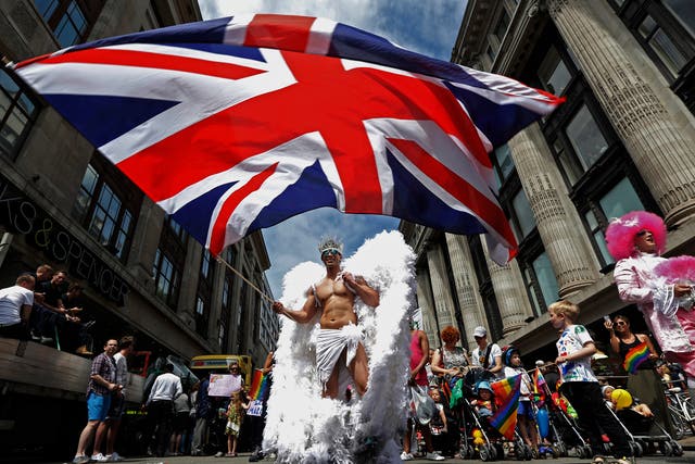 A member of the Pride parade in 2013 proudly waves the British flag