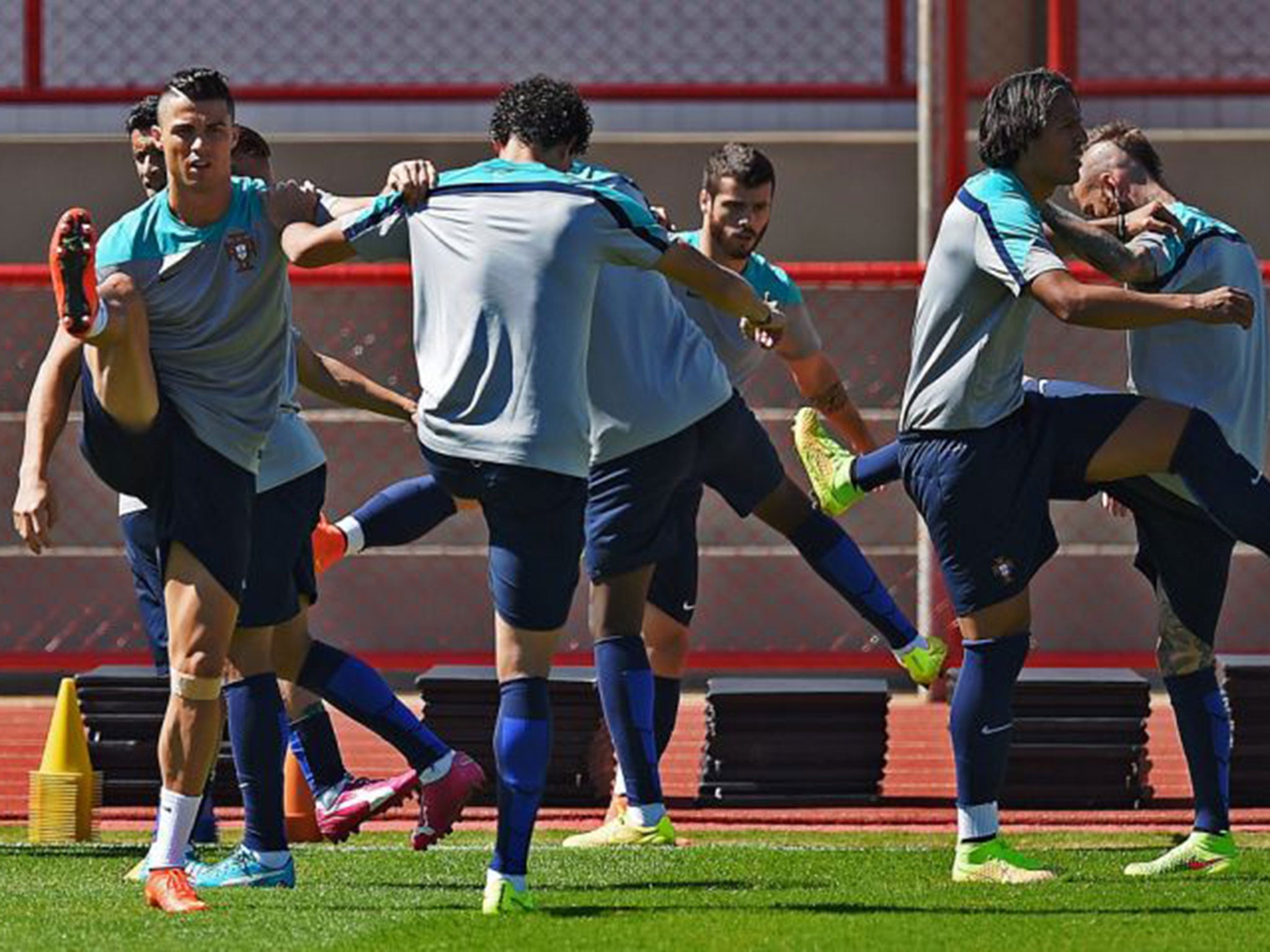 Ronaldo, left, trains with the Portugal squad before they attempt to lift themselves from the foot of Group G against Ghana