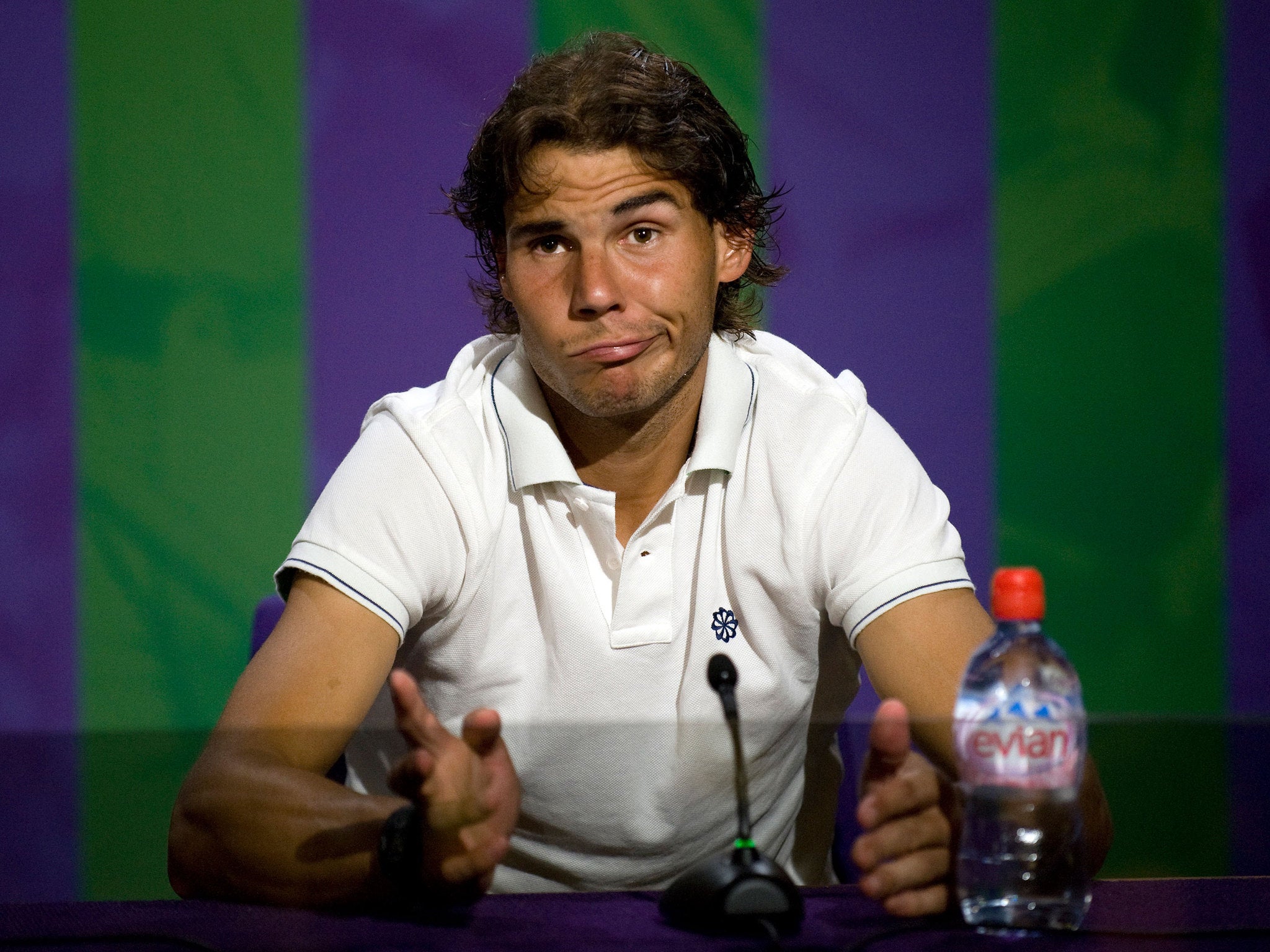Spain's Rafael Nadal speaks during a press conference after he was beaten in his second round men's singles match by Czech Republic's Lukas Rosol on day four of the 2012 Wimbledon Championships