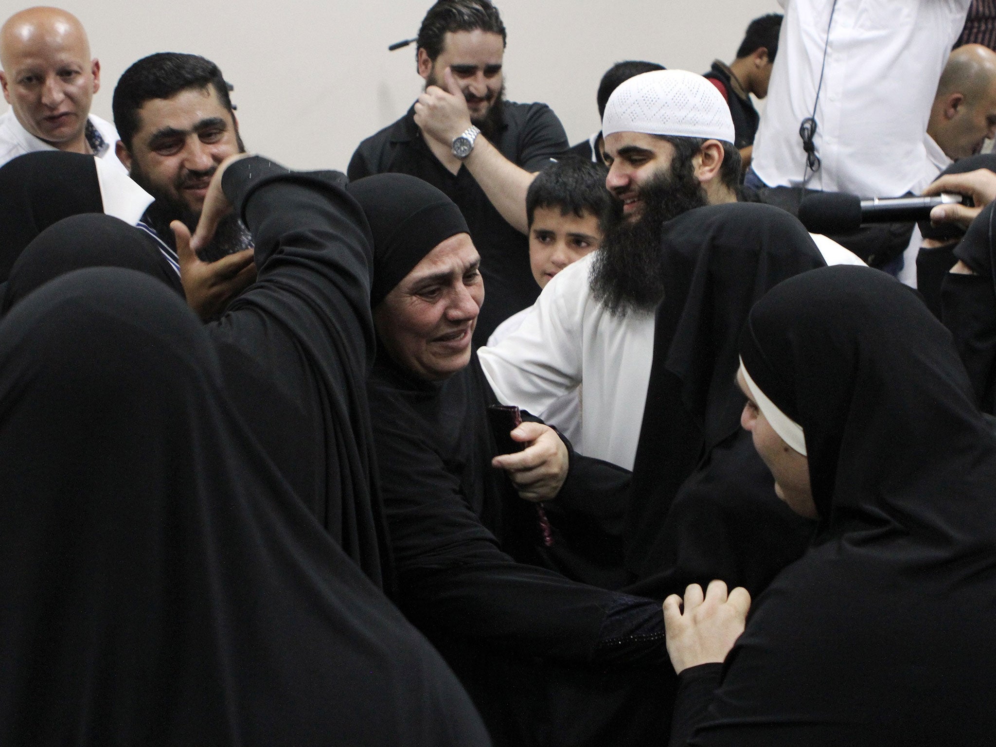 Relatives of radical Abu Qatada react to his acquittal in June by a Jordanian military court in Amman