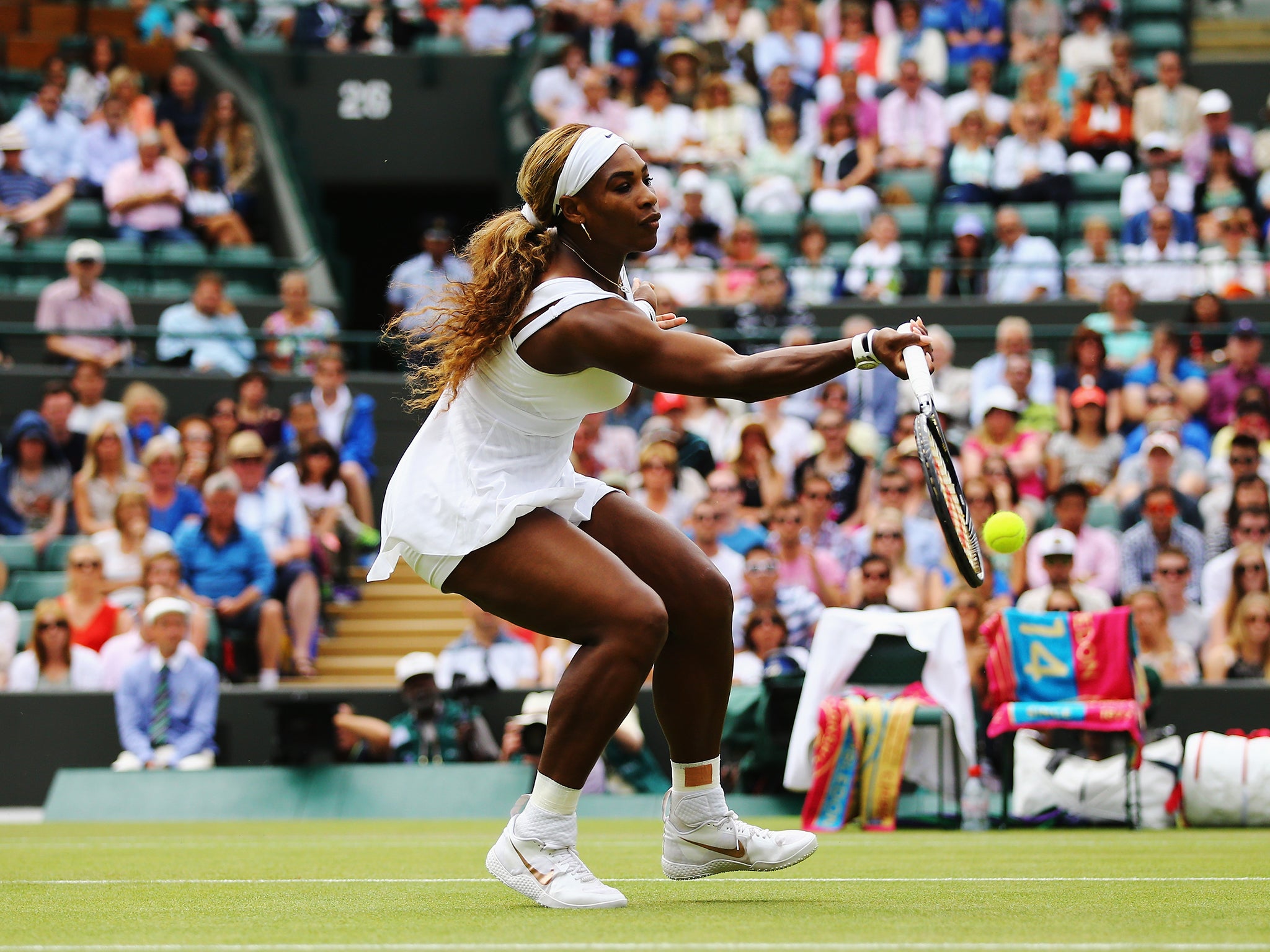 Serena Williams takes a shot during her victory over Chanelle Scheepers