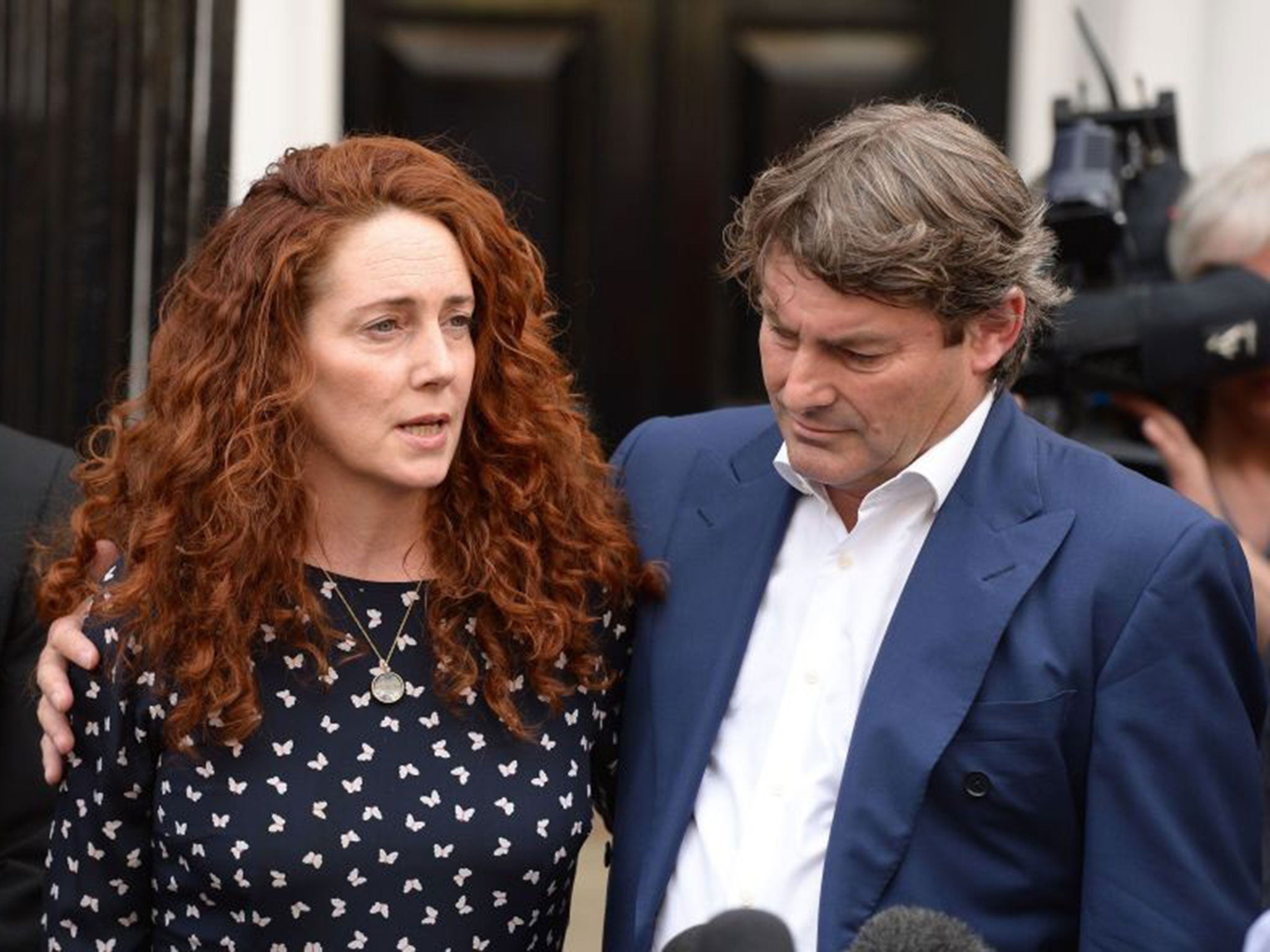 Rebekah Brooks and her husband Charlie giving a statement