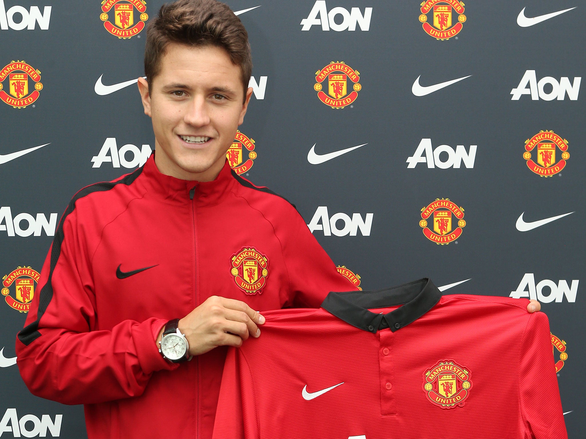 Ander Herrera poses with his new Manchester United shirt