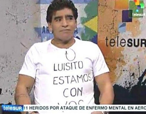 Diego Maradona and his Luis Suarez T-shirt