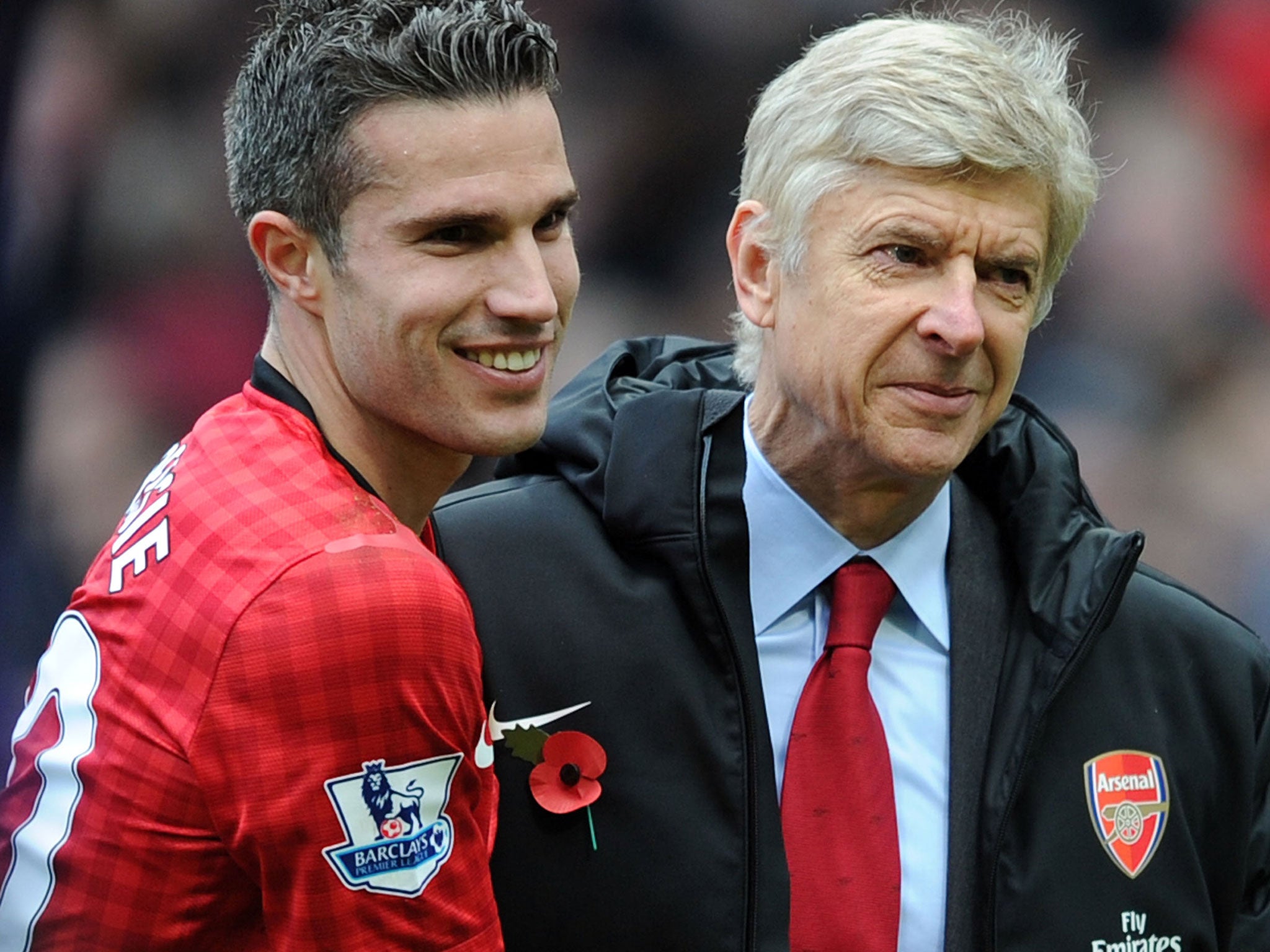 Arsene Wenger greets Robin van Persie in November 2012