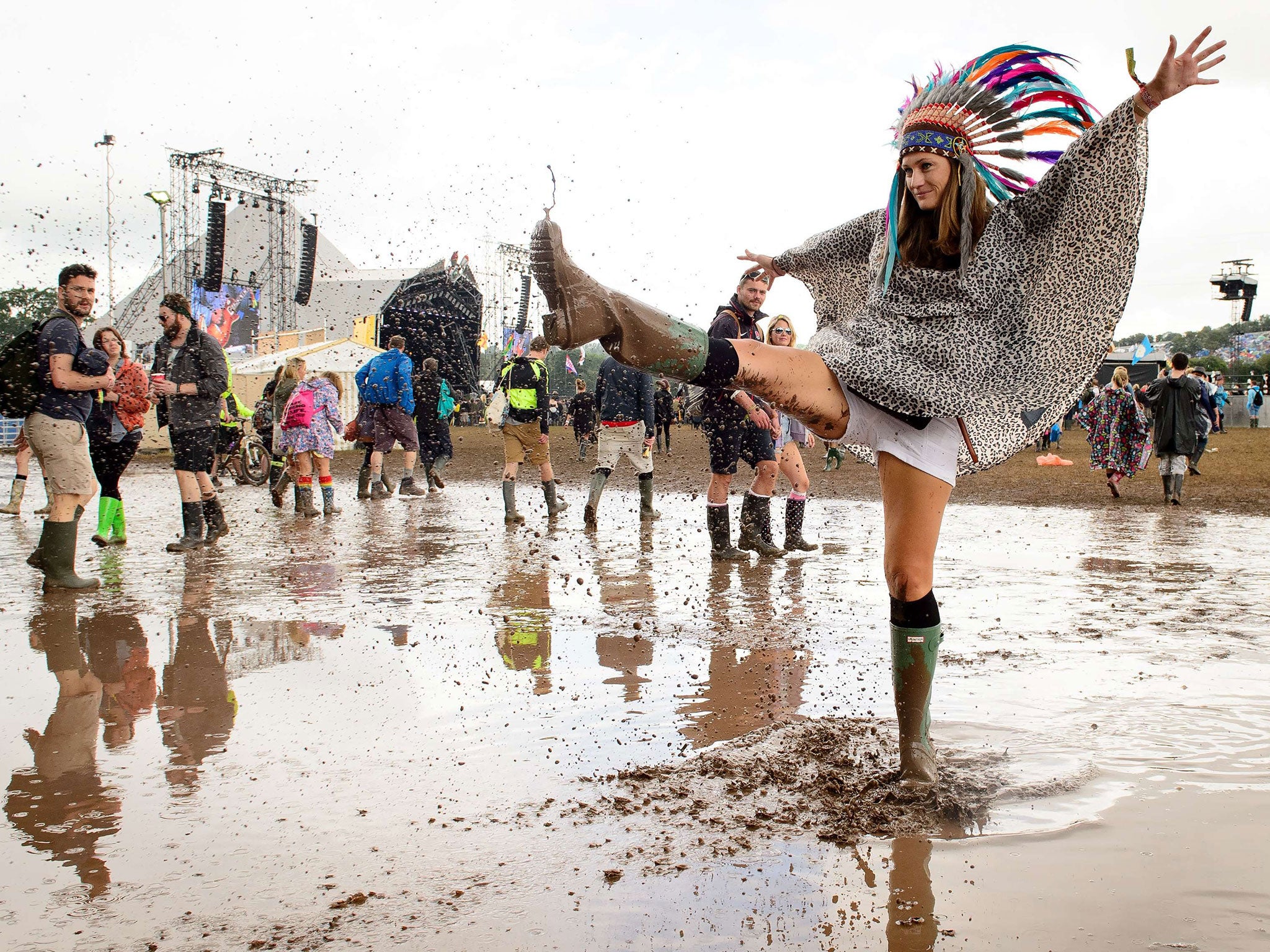 Festival-goers enjoy the mud at Glastonbury Festival