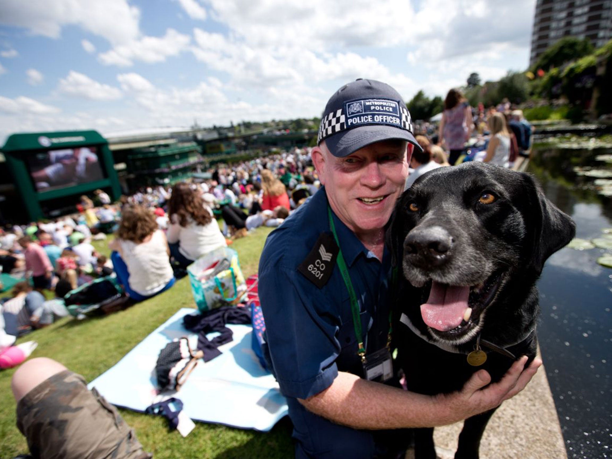 Dylan with his owner, Sergeant Martin Proctor, who both retired at Wimbledon