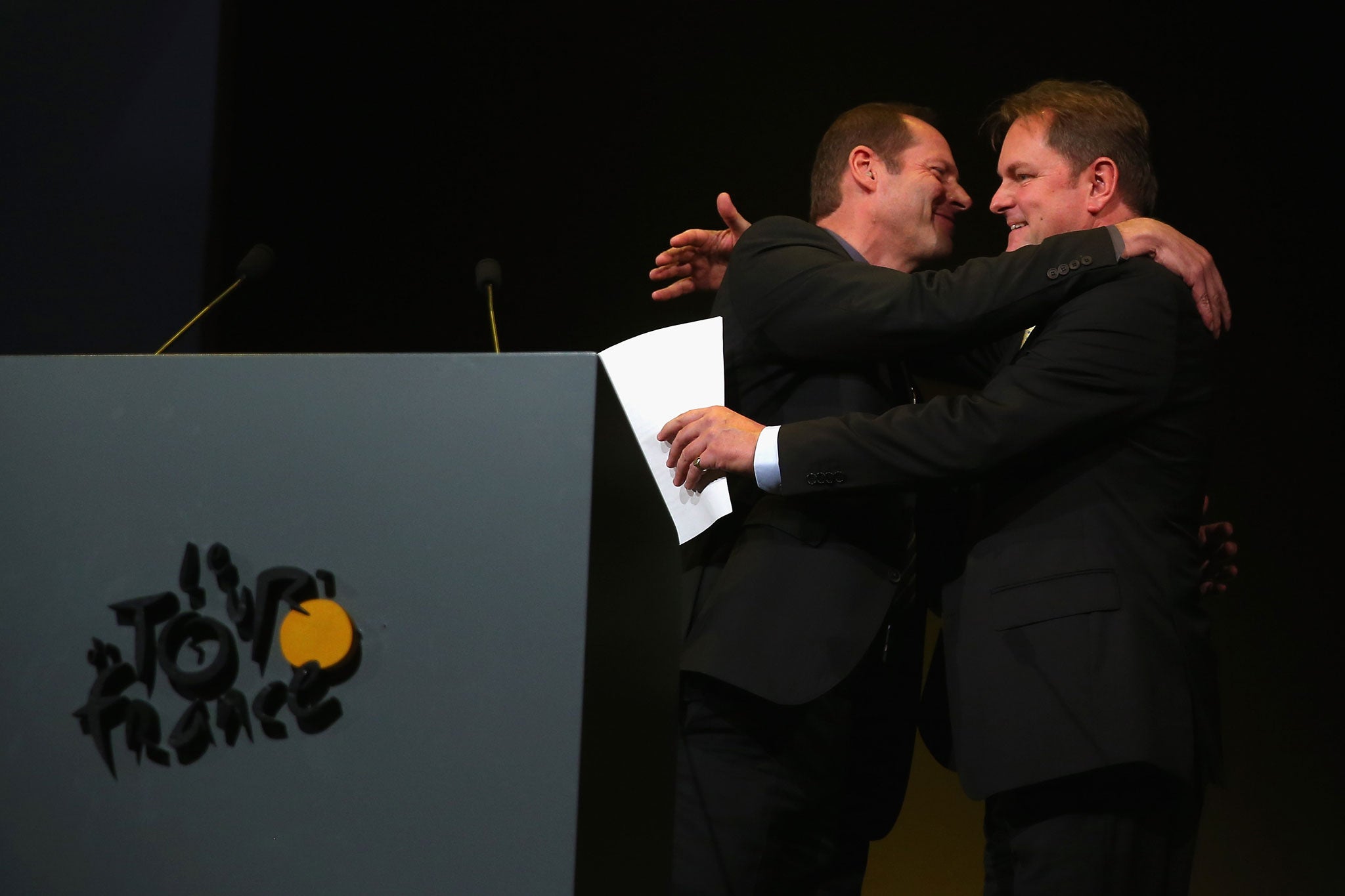 Brothers in arms: Gary Verity (right) embraces Christian Prudhomme at the route presentation for the 2014 Tour