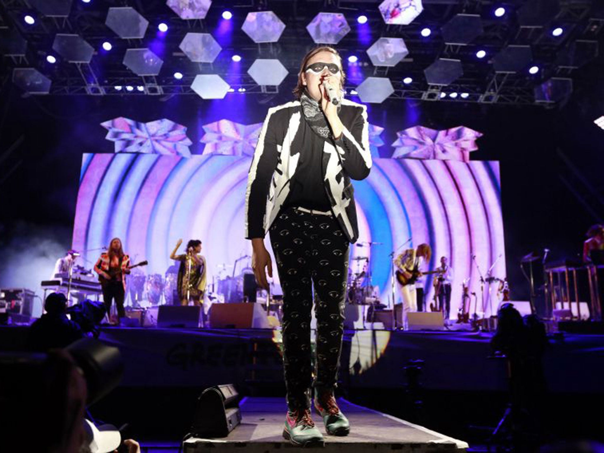 Arcade Fire did just enough to put fire in the bellies of an eager festival crowd