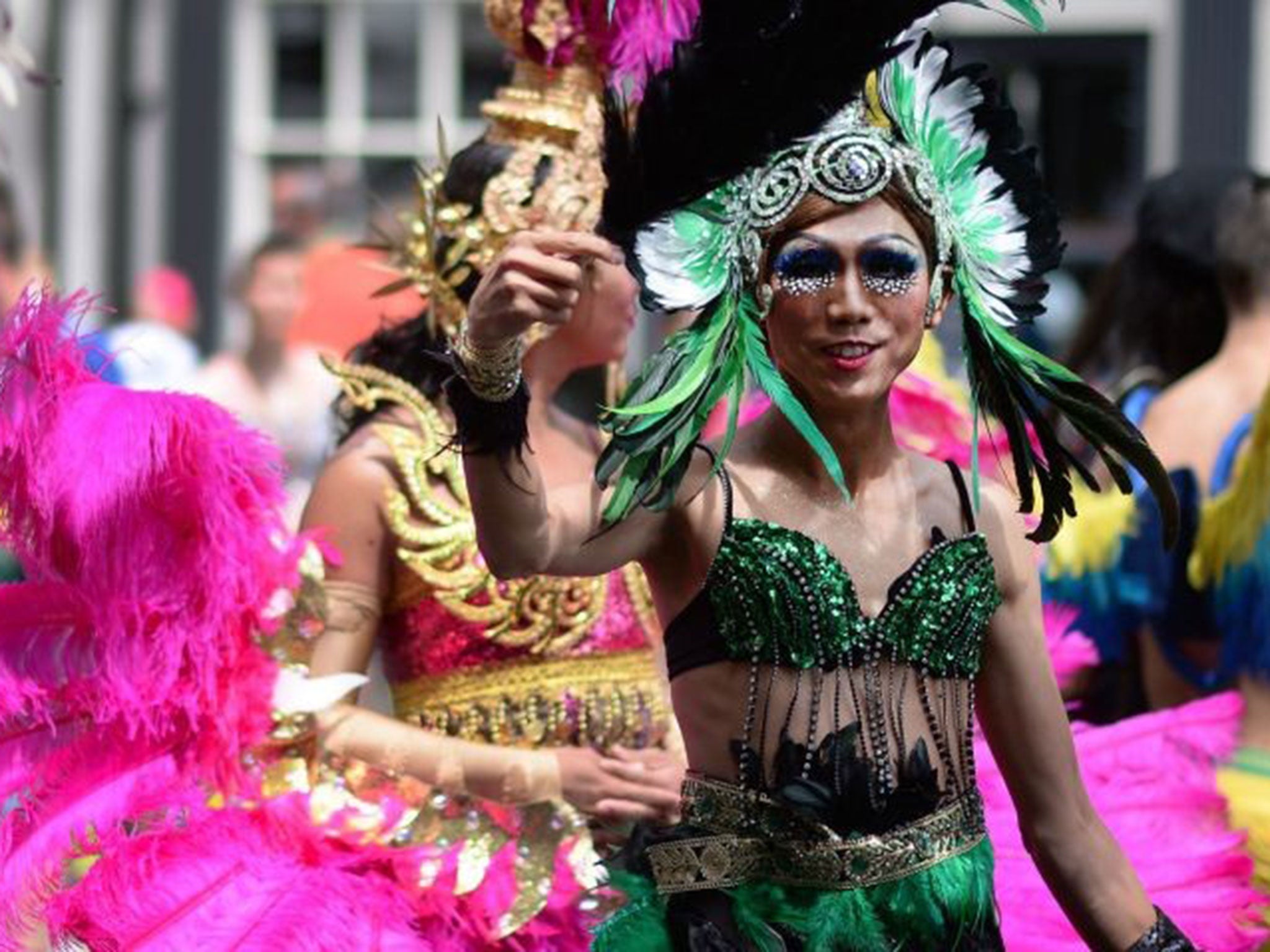 Revellers take part in the London Pride Parade 2014 in central London