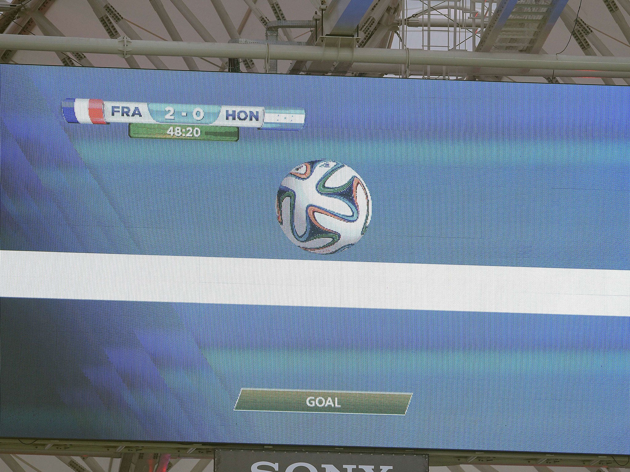 A giant screen in the stadium gives a goal using the new goal line technology