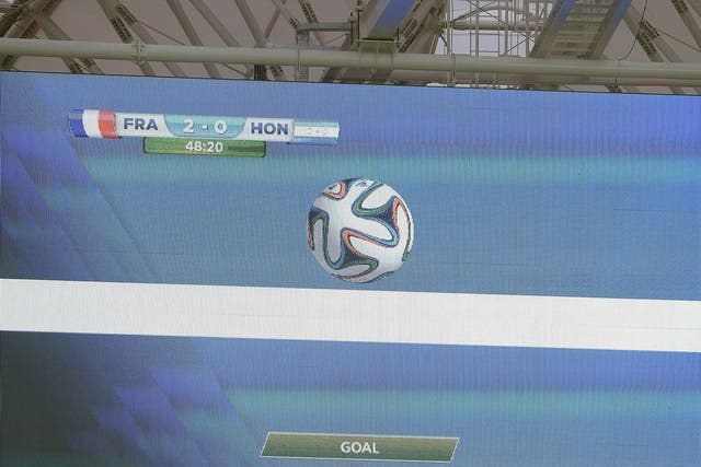 A giant screen in the stadium gives a goal using the new goal line technology