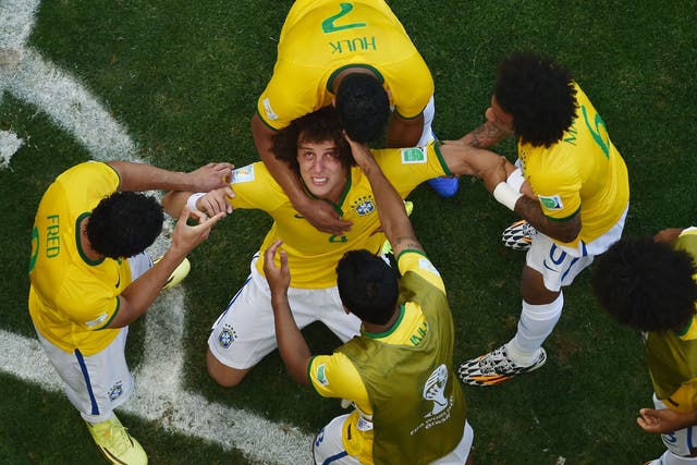Brazil players celebrate after beating Chile on penalties to make it through to the quarter-finals of the World Cup