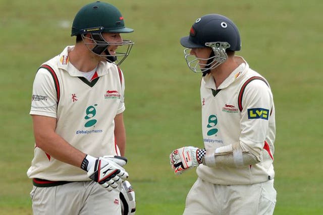 Double delight: Leicestershire’s Greg Smith, left, and Angus Robson chat on the way to a century apiece
