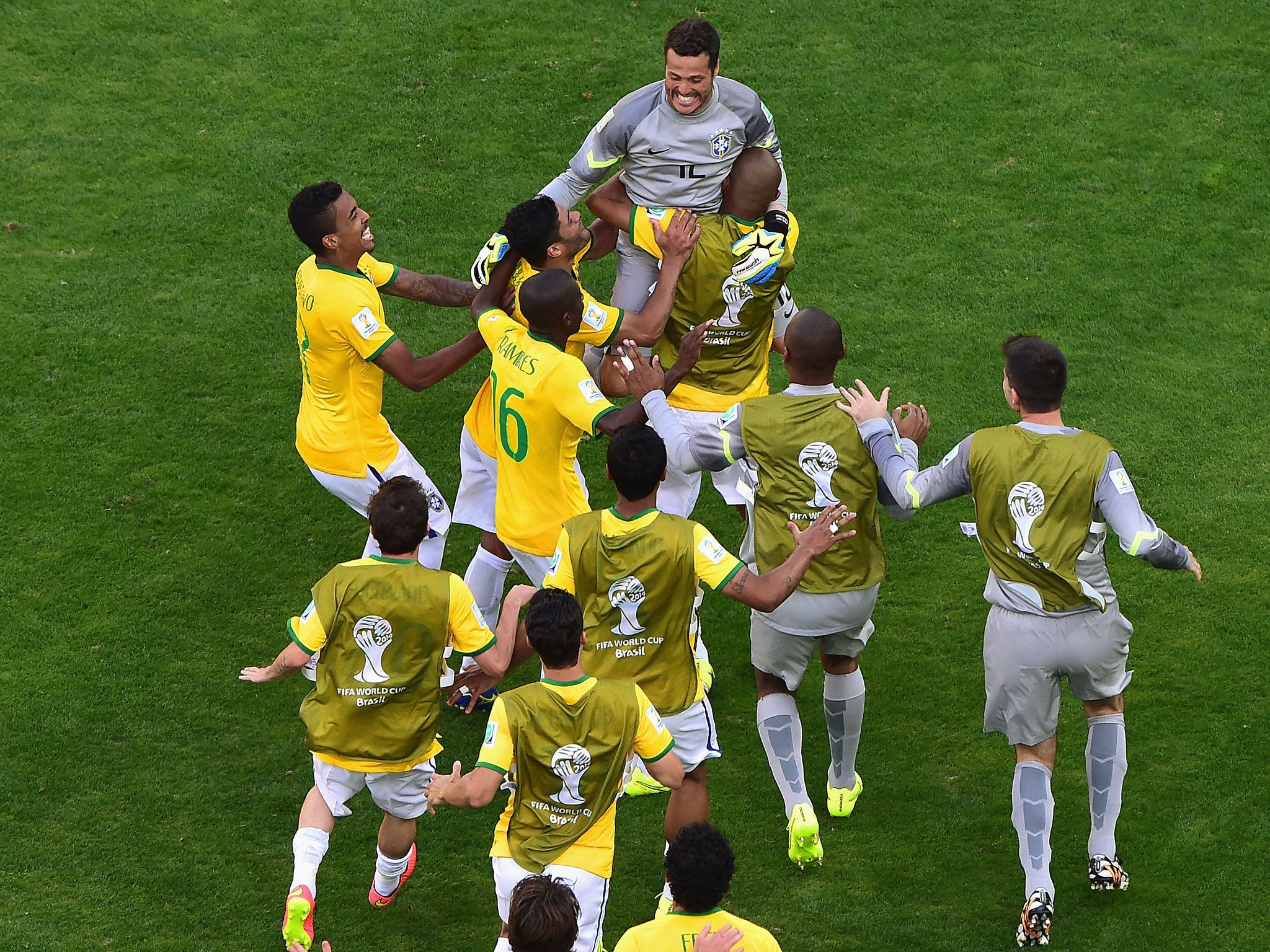Julio Cesar saves two penalties in the shoot-out as Brazil scraped into the quarter-finals of the World Cup against Chile
