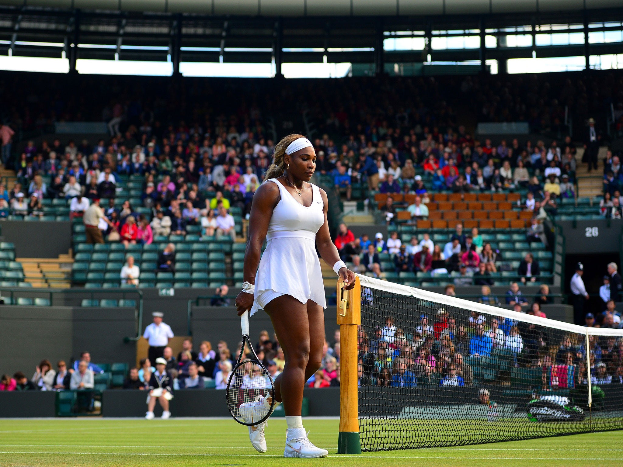 Serena Williams trudges off centre court after losing to Alize Cornet