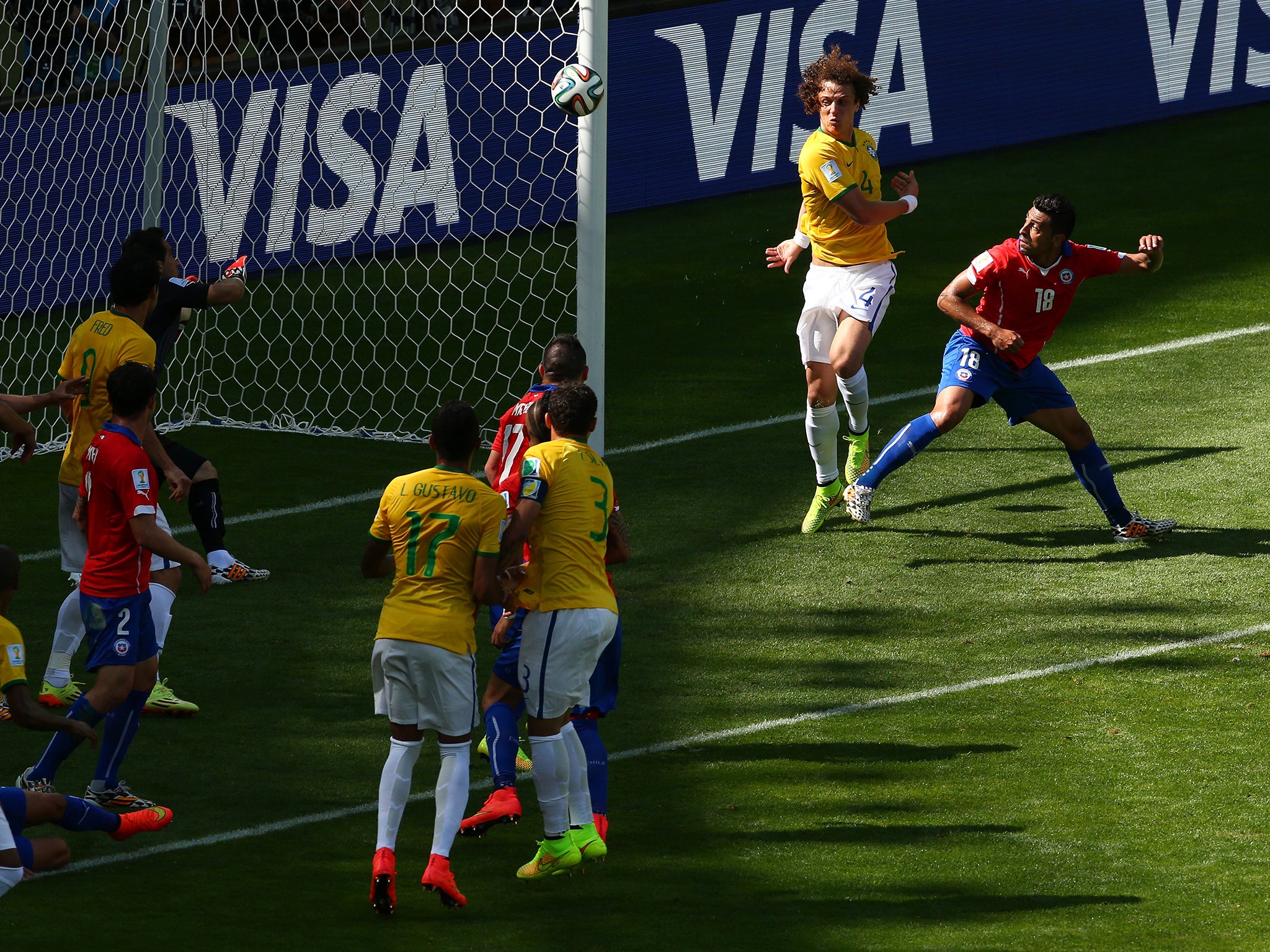 David Luiz and Gonzalo Jara both went for the ball before it went in the back of the net for Brazil