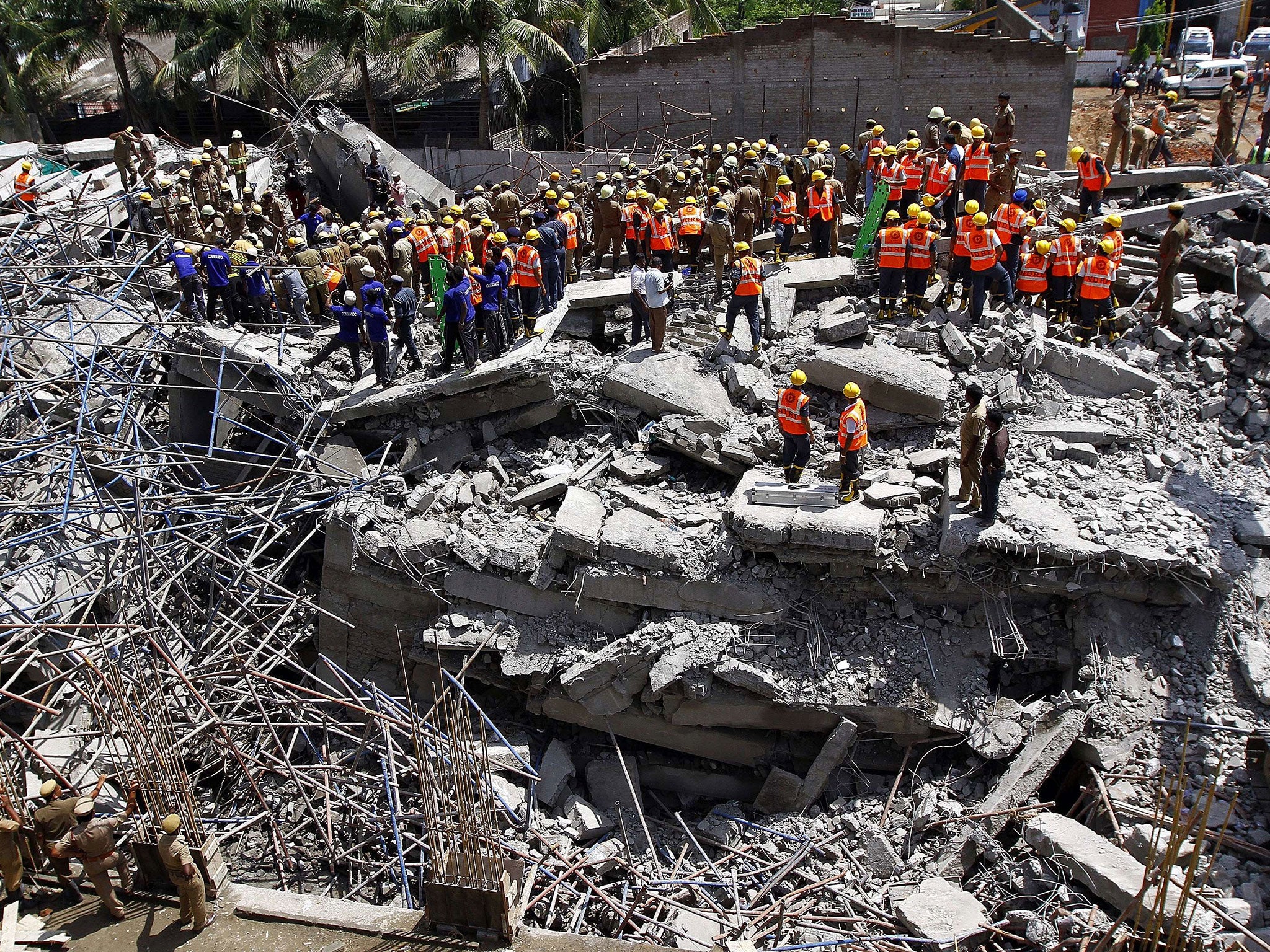 Nearly 90 workers were collecting their wages in the basement of the 11-storey building near Chennai when it collapsed