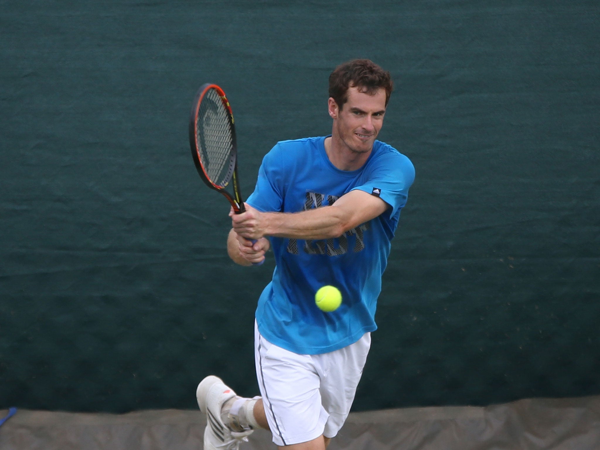 Andy Murray trains in the rain on Sunday