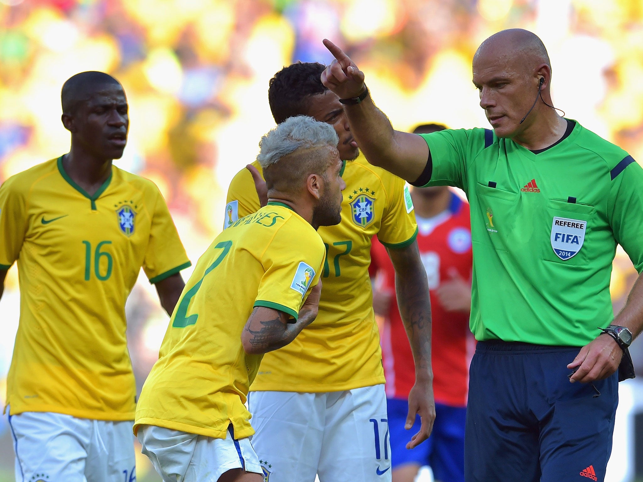 Brazil’s Danny Alves remonstrates with the referee Howard Webb during Saturday’s match