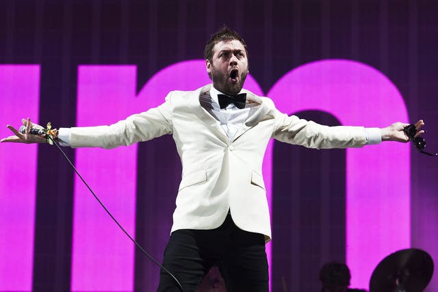 Kasabian frontman Tom Meighan performs on the Pyramid Stage at Glastonbury in 2014