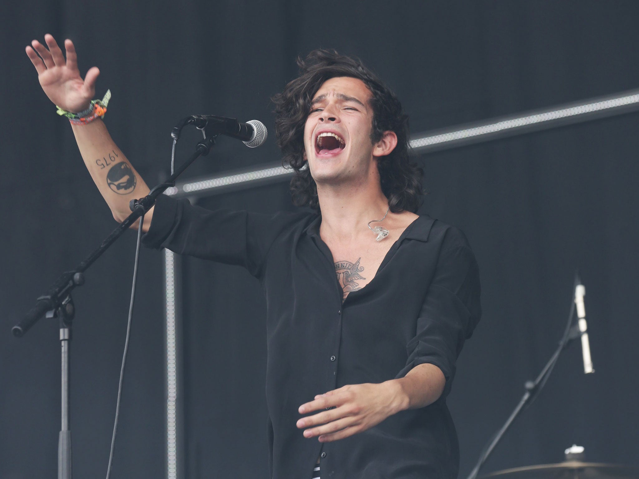 Matthew Healy of The 1975 performing on the Pyramid Stage at the Glastonbury Festival, at Worthy Farm in Somerset