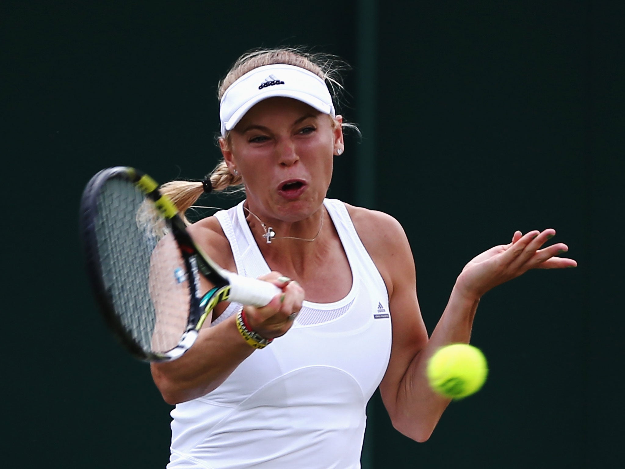 Caroline Wozniacki plays a return during her defeat by Barbora Zahlavova Strycova