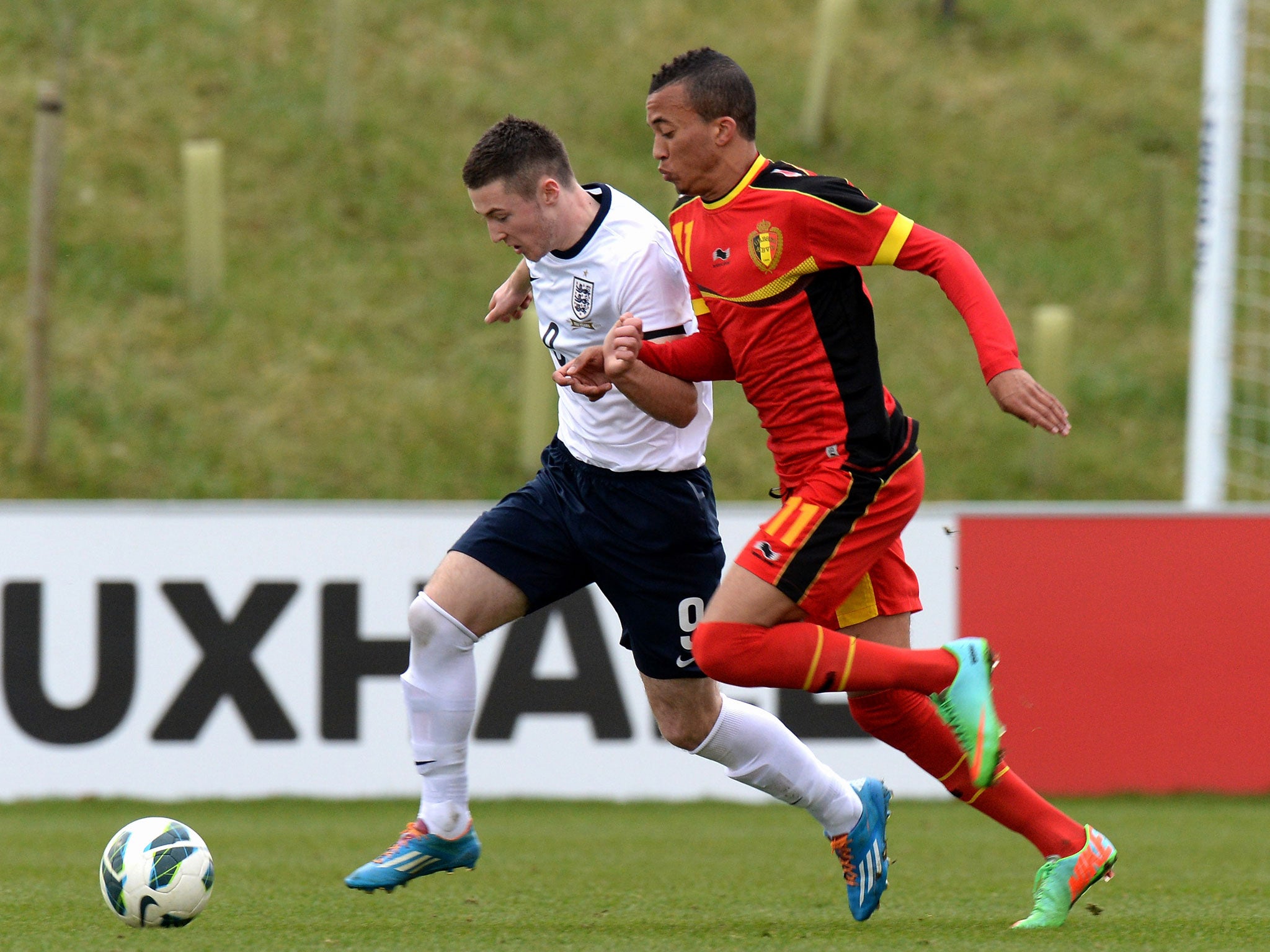 David Henen (right) competes for the ball during Belgium U-18s friendly against England in February