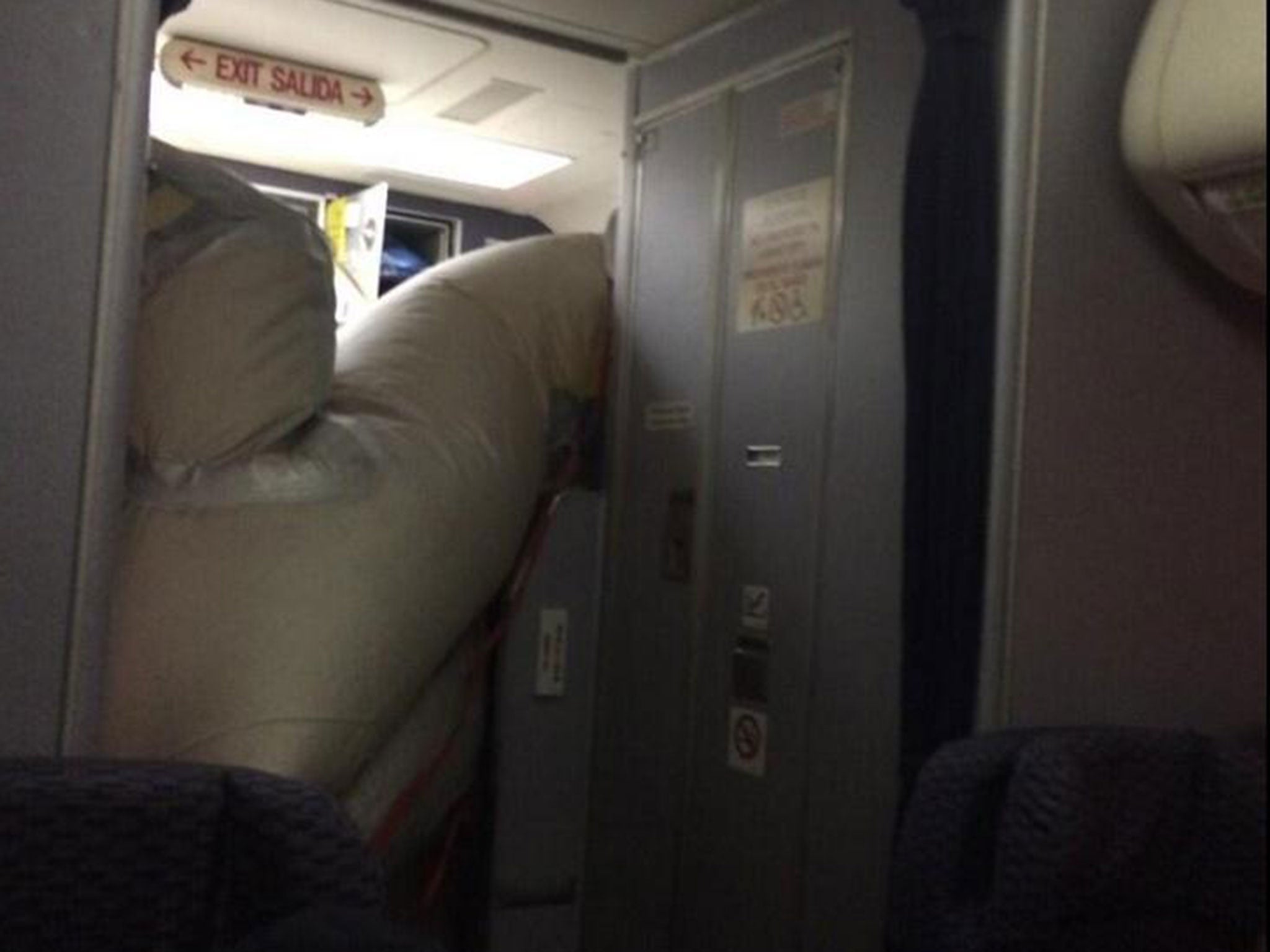 Emergency landing after evacuation slide accidentally inflates on