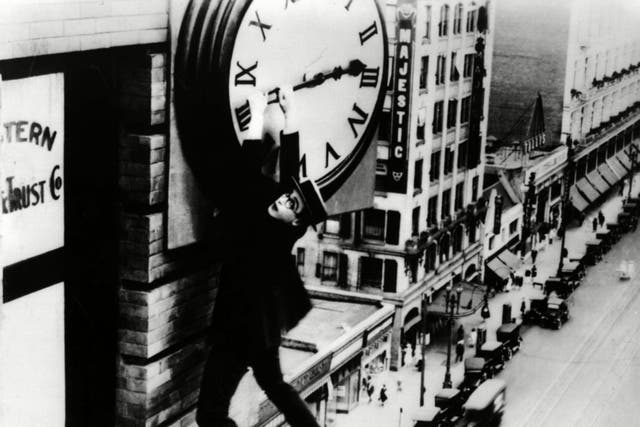 Time on his hands: silent comedian Harold Lloyd grasps the hands of a skyscraper’s clock in his film ‘Safety Last’ from 1923 