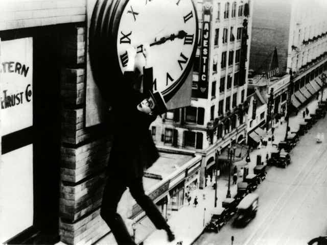 Time on his hands: silent comedian Harold Lloyd grasps the hands of a skyscraper’s clock in his film ‘Safety Last’ from 1923 
