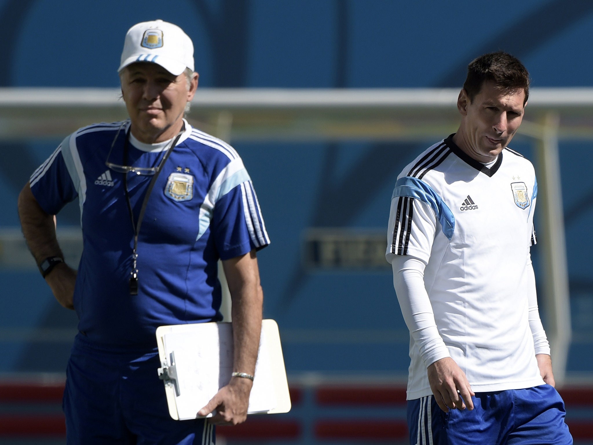 Argentina's forward Lionel Messi (R) is watched by coach Alejandro Sabella