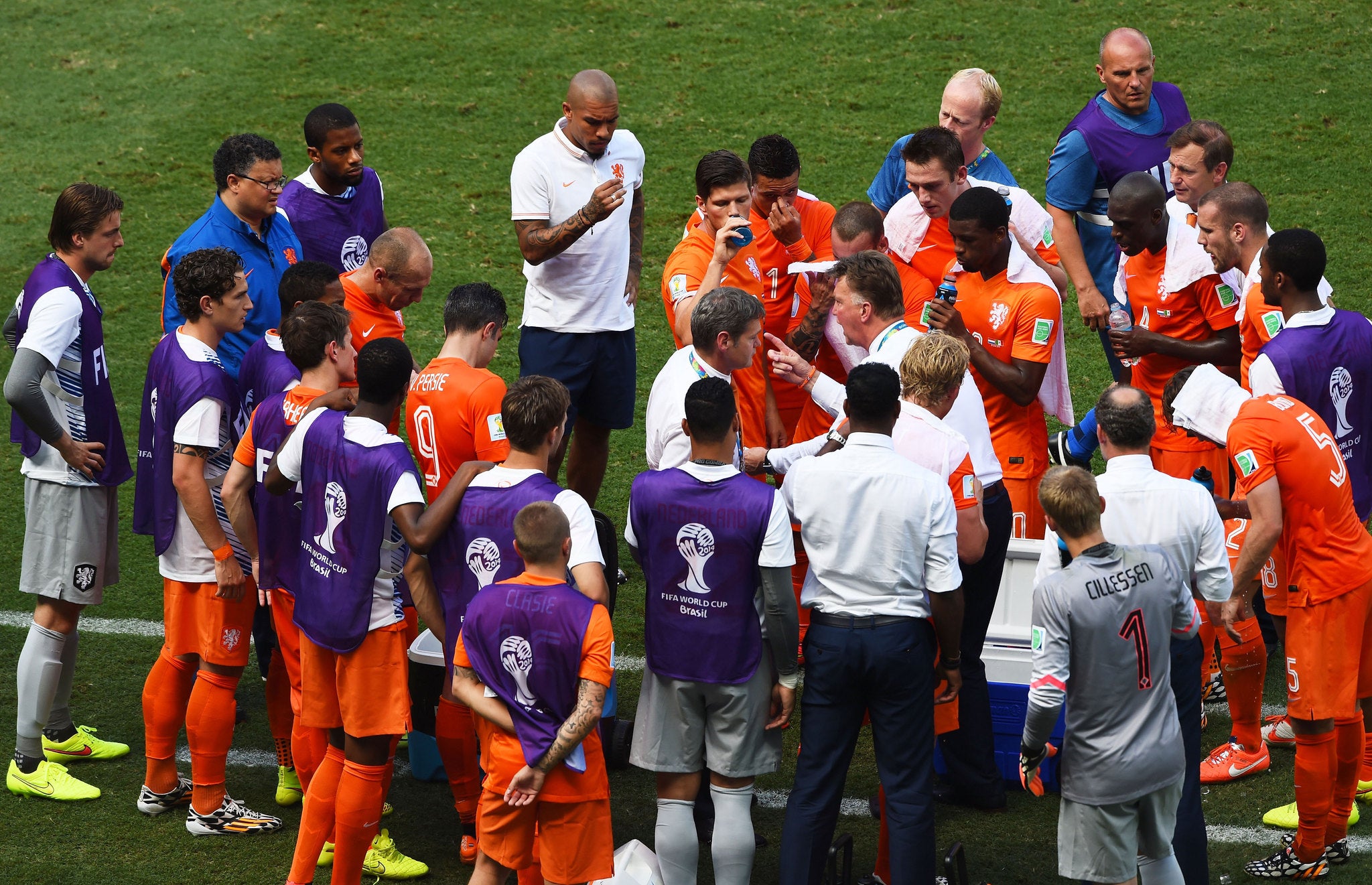 Louis van Gaal (centre) speaks to his squad during the cooling break during the match against Mexico