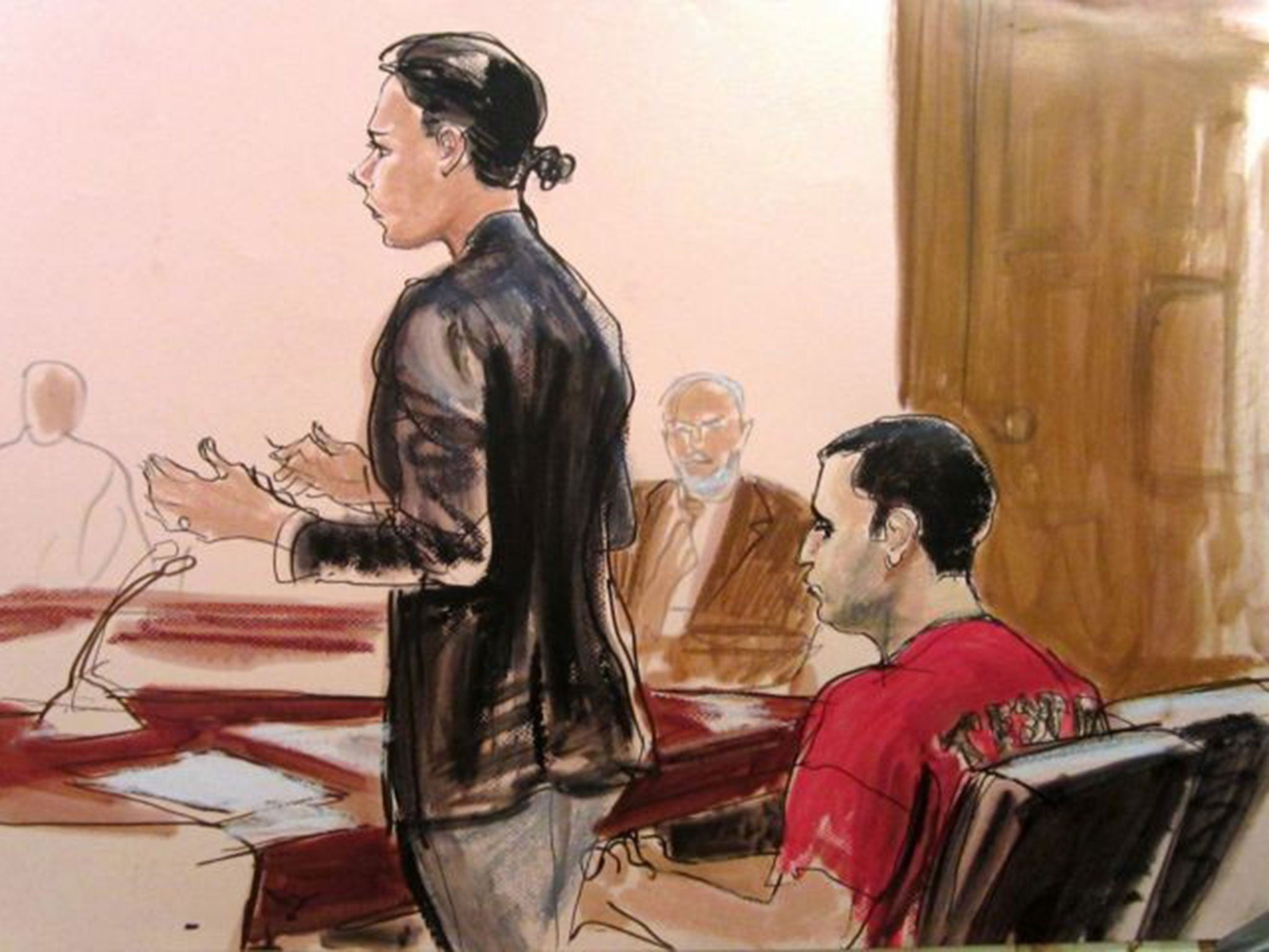 In this 25 October, 2012, file courtroom drawing, federal defender Julia Gatto requests bail for her client, New York City police Officer Gilberto Valle, right, at Manhattan Federal Court in New York