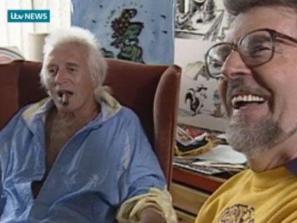 Footage from 1992 shows Rolf Harris drawing a portrait of Jimmy Savile as the pair joke together at ITV West studios in Bristol.
