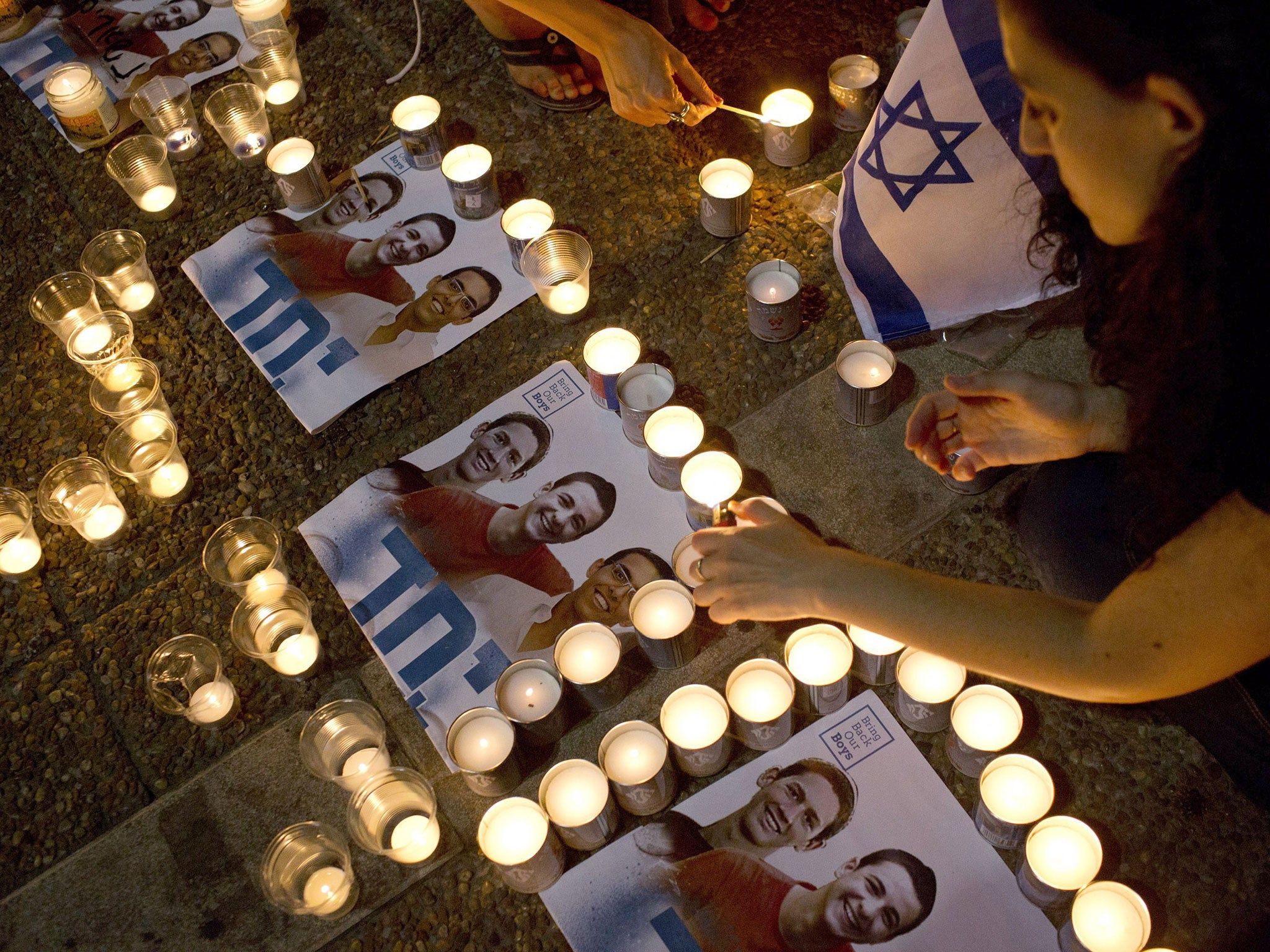 Israelis mourns and light candles in Rabin Square in Tel Aviv after the announce that the bodies of the three missing Israeli teenagers were found. Israel confirmed finding the bodies of three teenagers who disappeared in the southern West Bank, blaming t