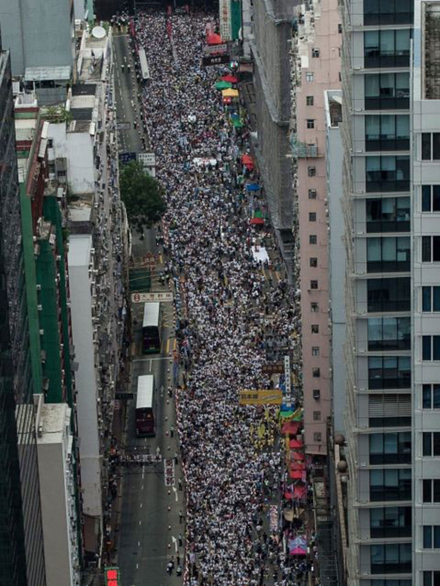 Tens of thousands of Hong Kong residents took to the streets for the annual 1 July demonstration to mark the surrender of the territory to Chinese control in 1997, in what organisers said they hoped would be the biggest challenge to Communist Party rule i