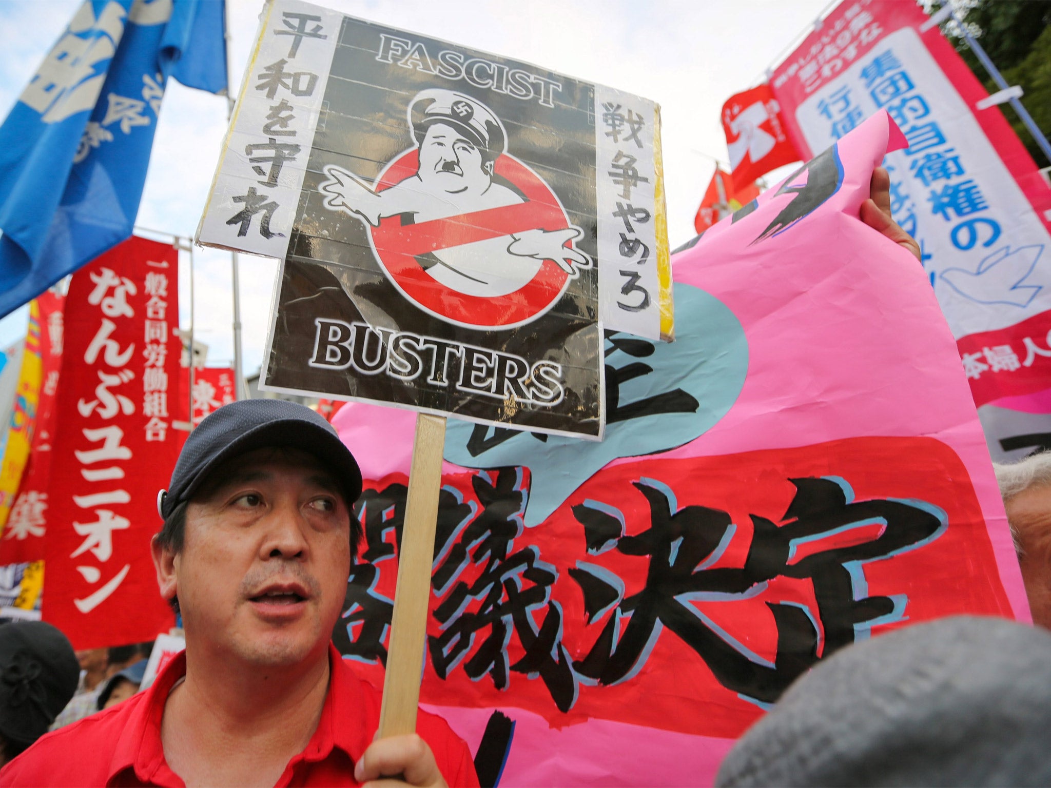 Protesters with anti-war placards hold a mass rally outside the Prime Minister’s office in Tokyo