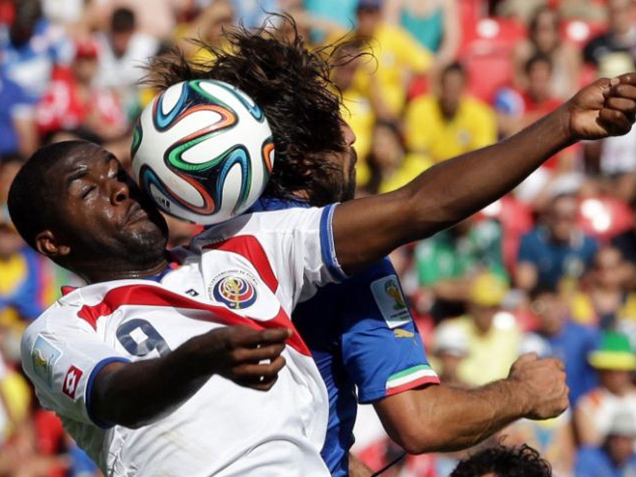 Joel Campbell, battling Italy’s Andrea Pirlo, has caused headaches for many defences at this World Cup AP
