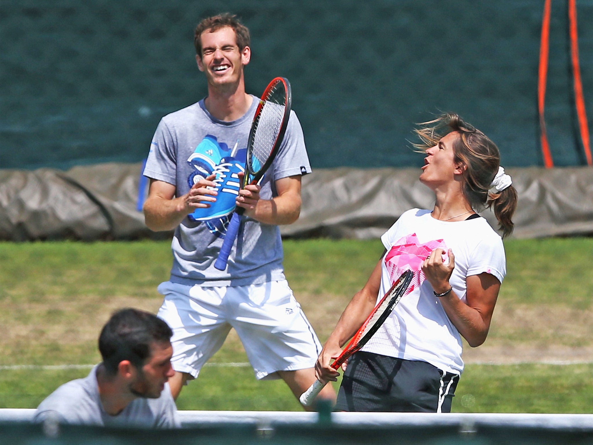 Andy Murray and his coach Amélie Mauresmo share a laugh during practice at Wimbledon