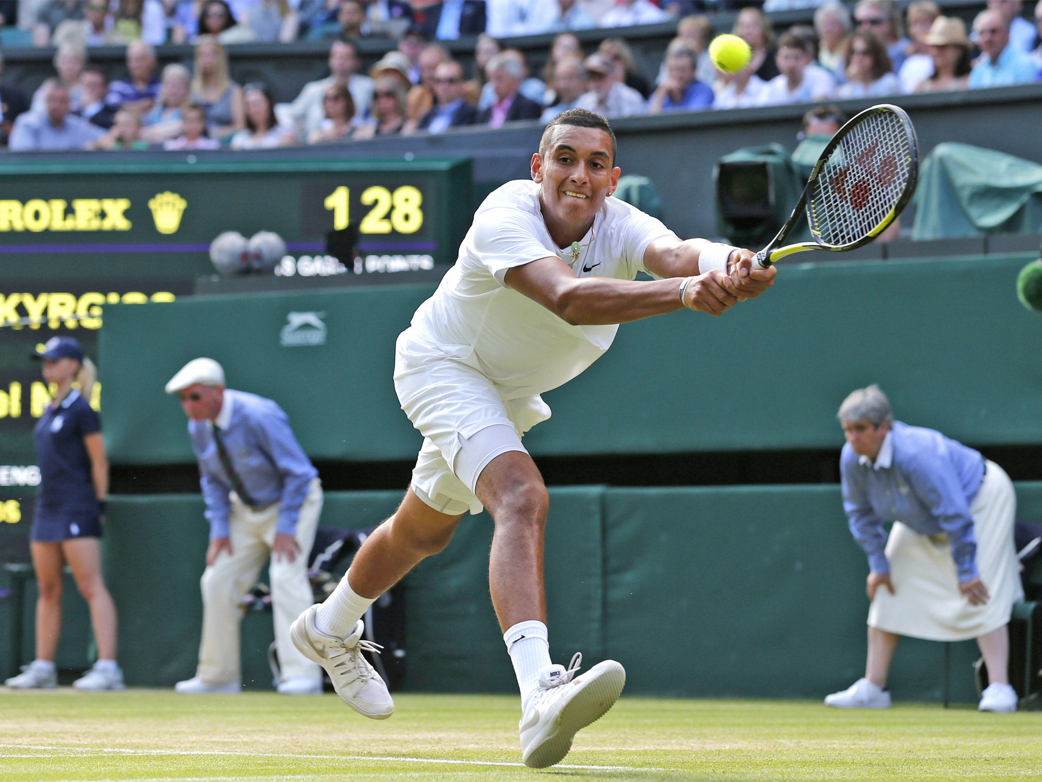 Nick Kyrgios stretches to play a return to Rafael Nadal in his remarkable upset victory