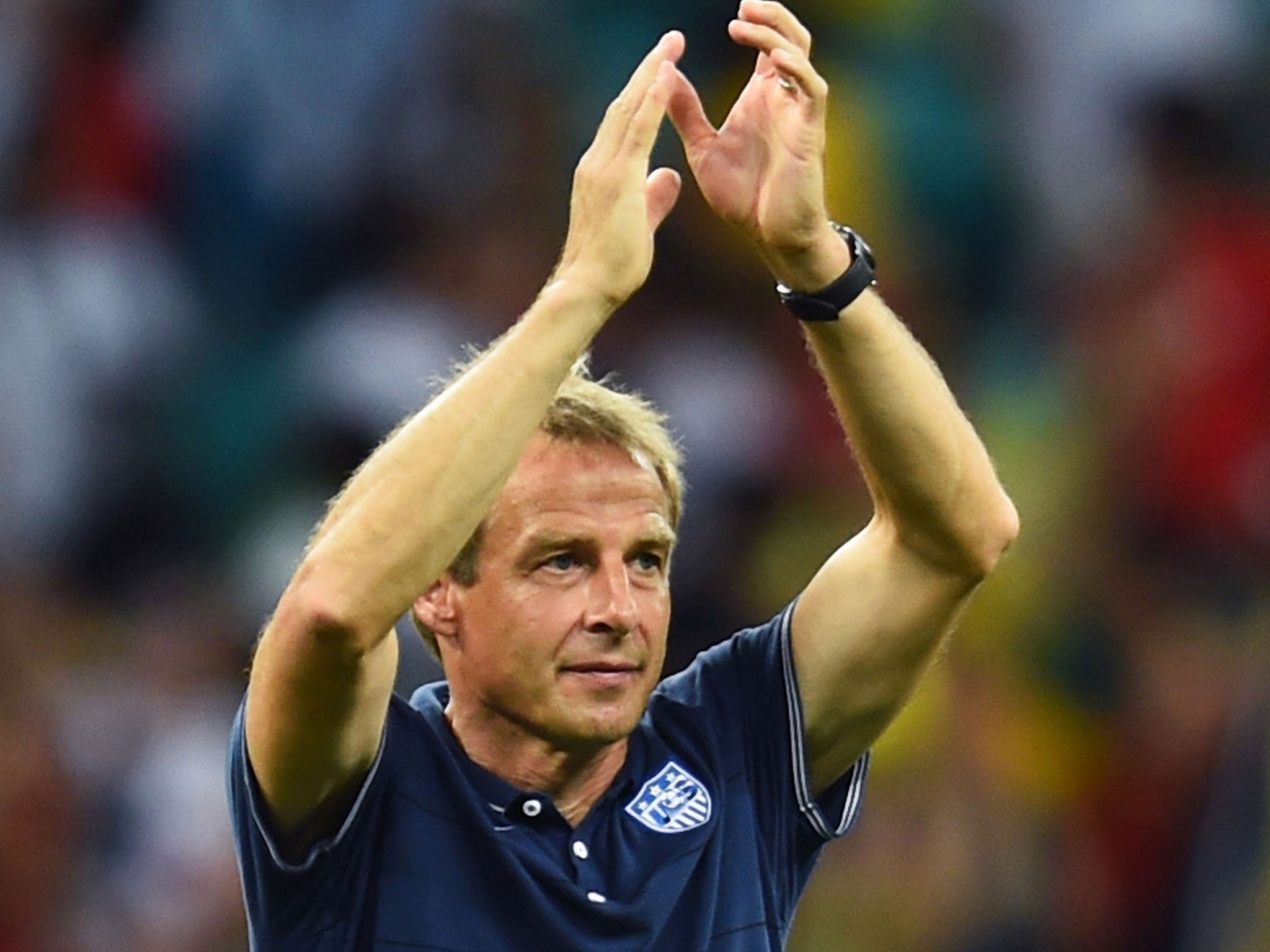 Jurgen Klinsmann acknowledges the United States faithful after the defeat