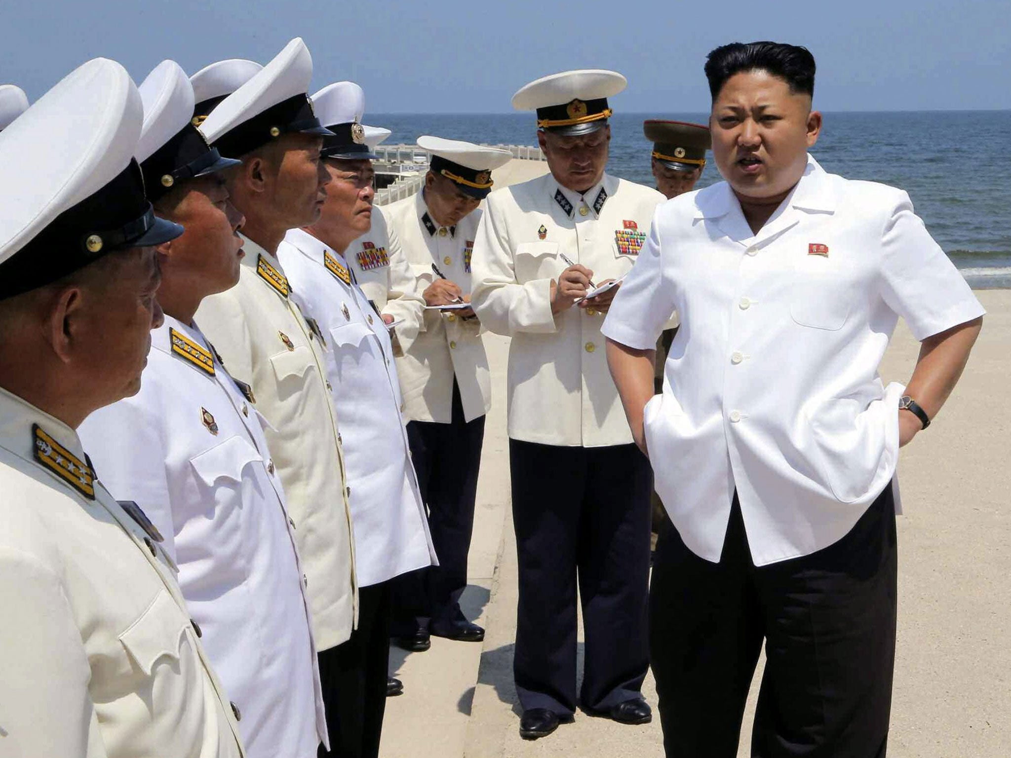 Kim Jong-un speaks to navy commanders ahead of a swimming drill in North Korea