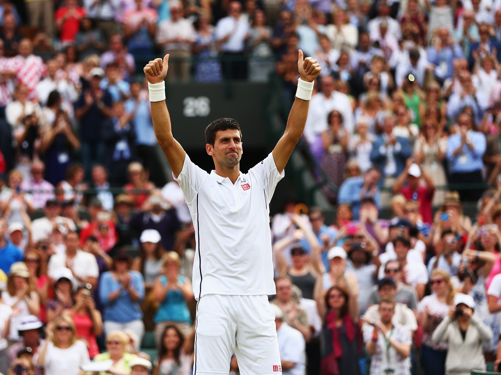 Novak Djokovic of Serbia celebrates after winning his Gentlemen's Singles quarter-final match against Marin Cilic
